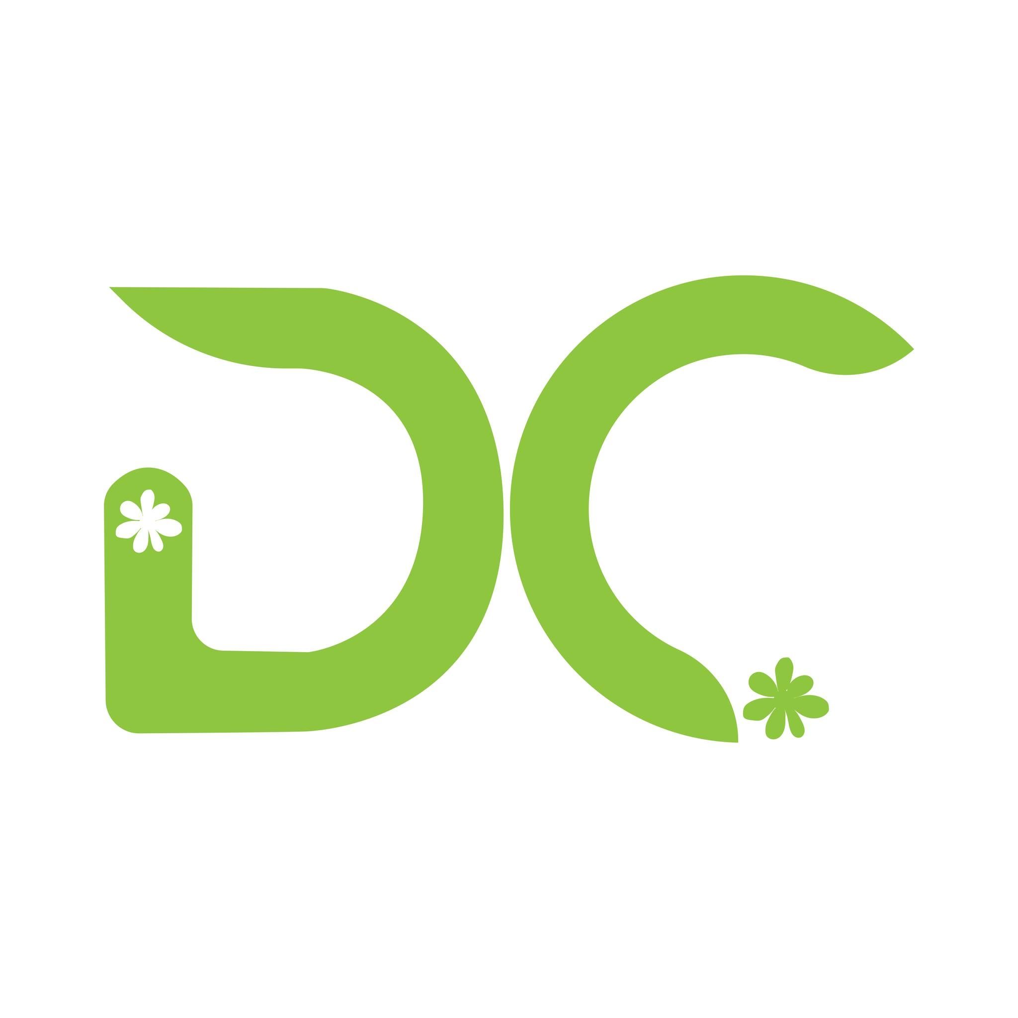 Desk with leather desk pad, walnut desk organizer, wireless keyboard and mouse, and porcelain mug.