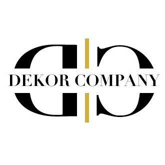 Desk with leather desk pad, walnut desk organizer, wireless keyboard and mouse, and porcelain mug.