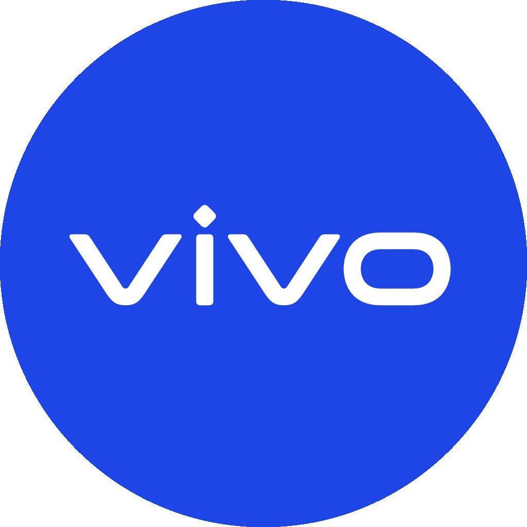 Desk with leather desk pad, walnut desk organizer, wireless keyboard and mouse, and porcelain mug.