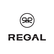 Desk with leather desk pad, walnut desk organizer, wireless keyboard and mouse, and porcelain mug.