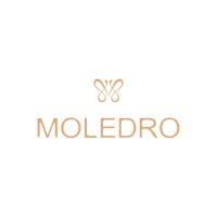 Desk with leather desk pad, walnut desk organizer, wireless keyboard and mouse, and porcelain mug.