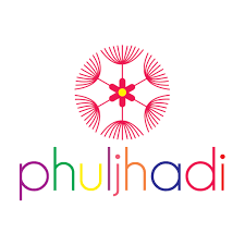 Desk with leather desk pad, walnut desk organizer, wireless keyboard and mouse, and porcelain mug.